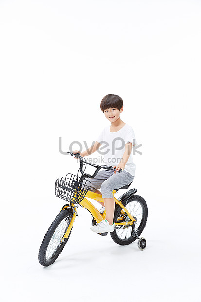 little boy riding bike