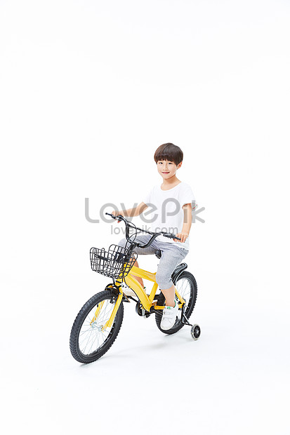 little boy riding bike
