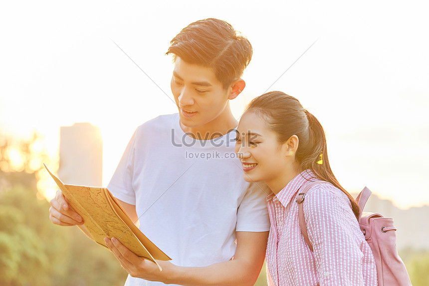 Young Couple Holding A Map Travel Photo Image Picture Free