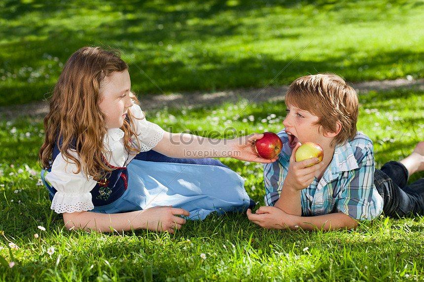 Feeding boy on sale with girl