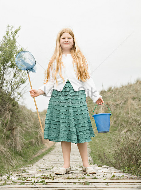 Beautiful woman holding fishing net hi-res stock photography and