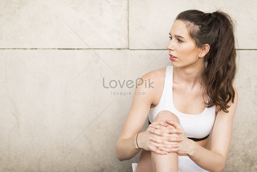 Featured image of post Sitting Against Wall Side View : Woman sitting against white wall stock photos &amp; woman.