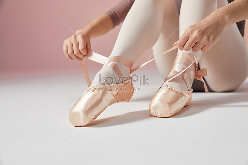 Young beautiful woman in ballet shoes 