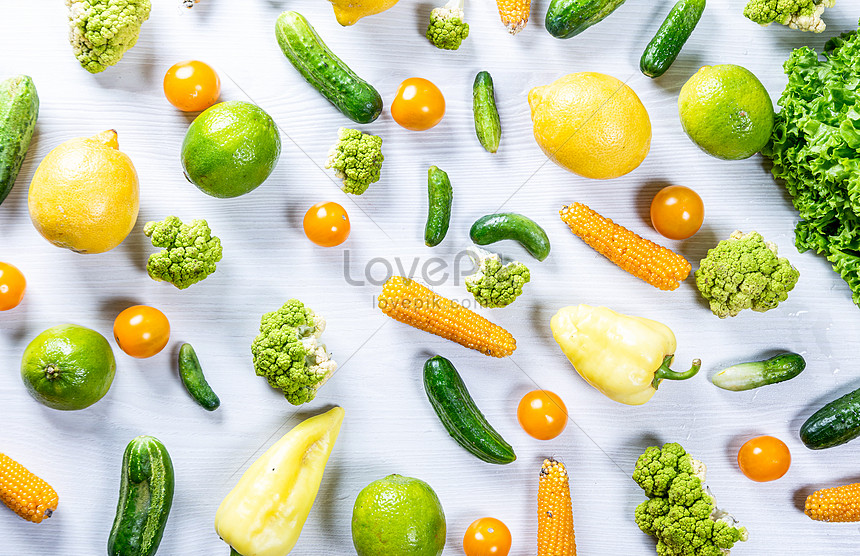 Green and yellow fruits and vegetables on white wooden table photo image_picture free download 501622769_lovepik.com