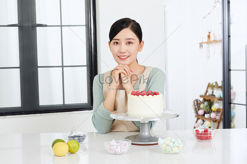 Beautiful young woman with birthday cake Stock Photo by ©belchonock  147549745