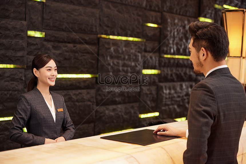 Hotel Front Desk Staff Check In For Customers Picture And HD Photos ...