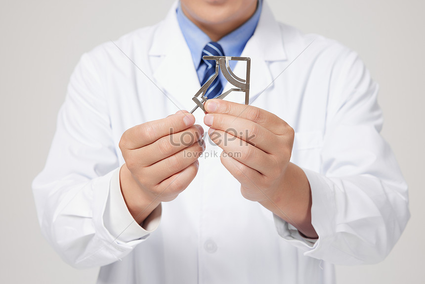 Close Up Of Male Doctor Holding Facial Measuring Instrument In Hand ...