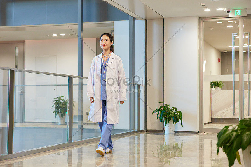 Female Doctor Walking In The Hospital Corridor Picture And HD Photos ...