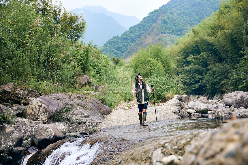 Young girl walking down trail hi-res stock photography and images