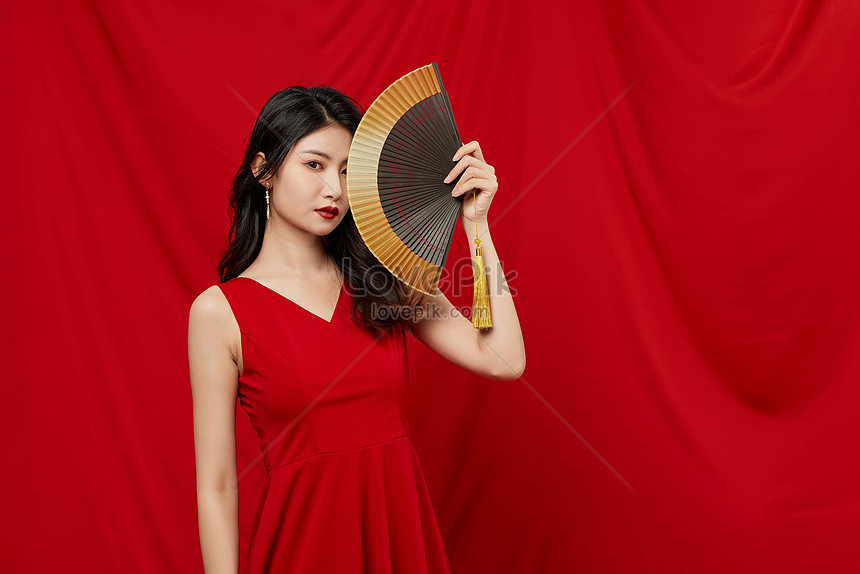 Female Hand Holding Fan On Red Background Picture And HD Photos | Free ...