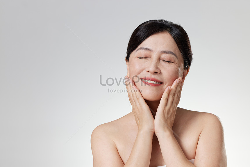 Middle-aged Woman Touching Facial Skin Picture And HD Photos | Free ...